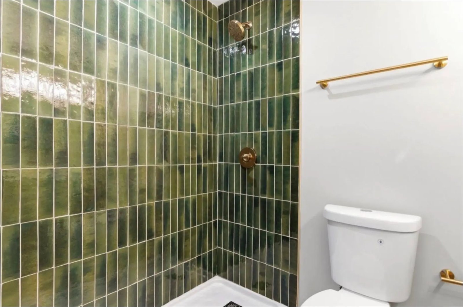Green Tile Shower with Brass Fixtures