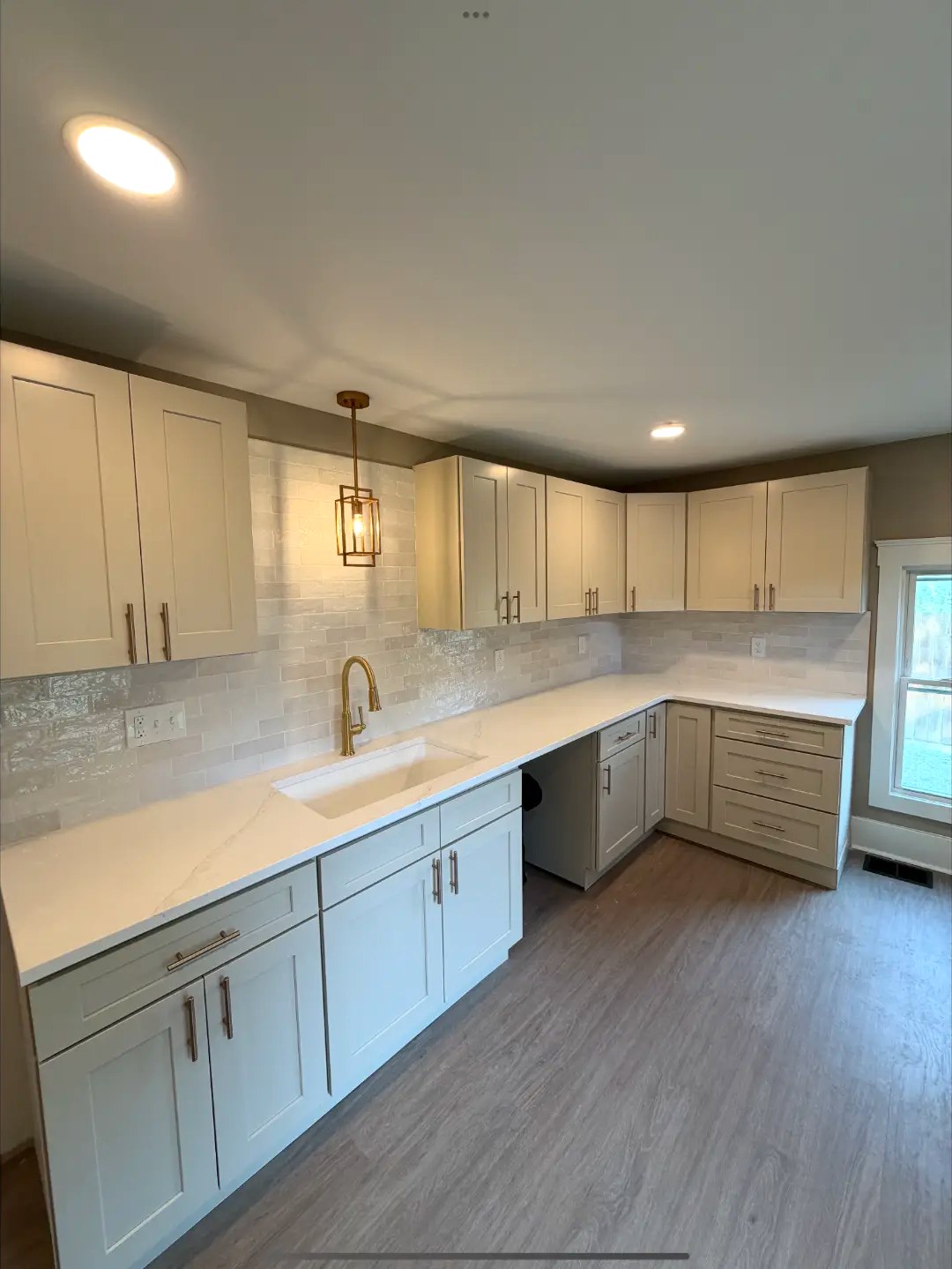 Quartz Counters & Gold Pendant Kitchen