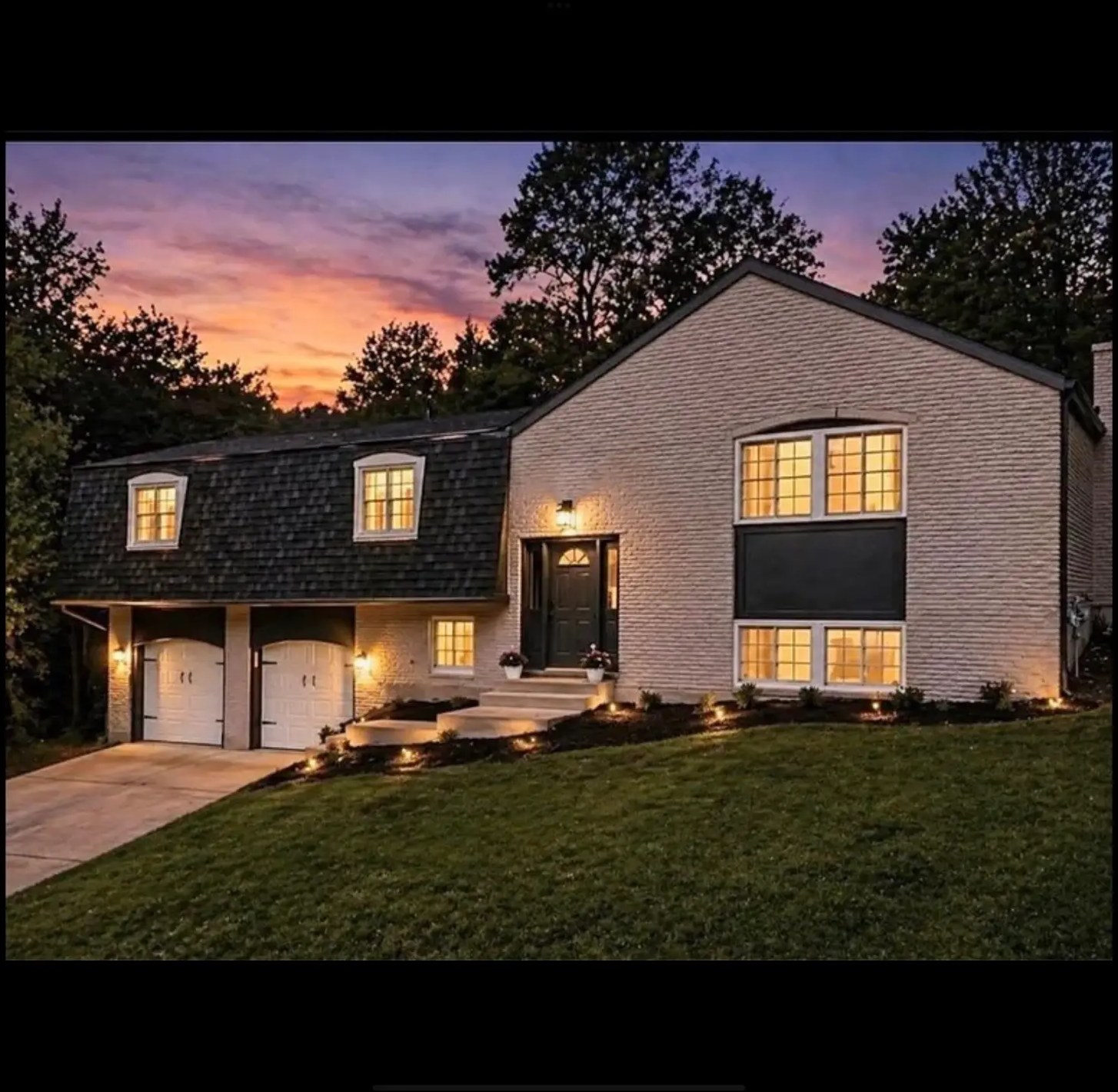 Renovated brick home at sunset purchased and updated by Green's Enterprises
