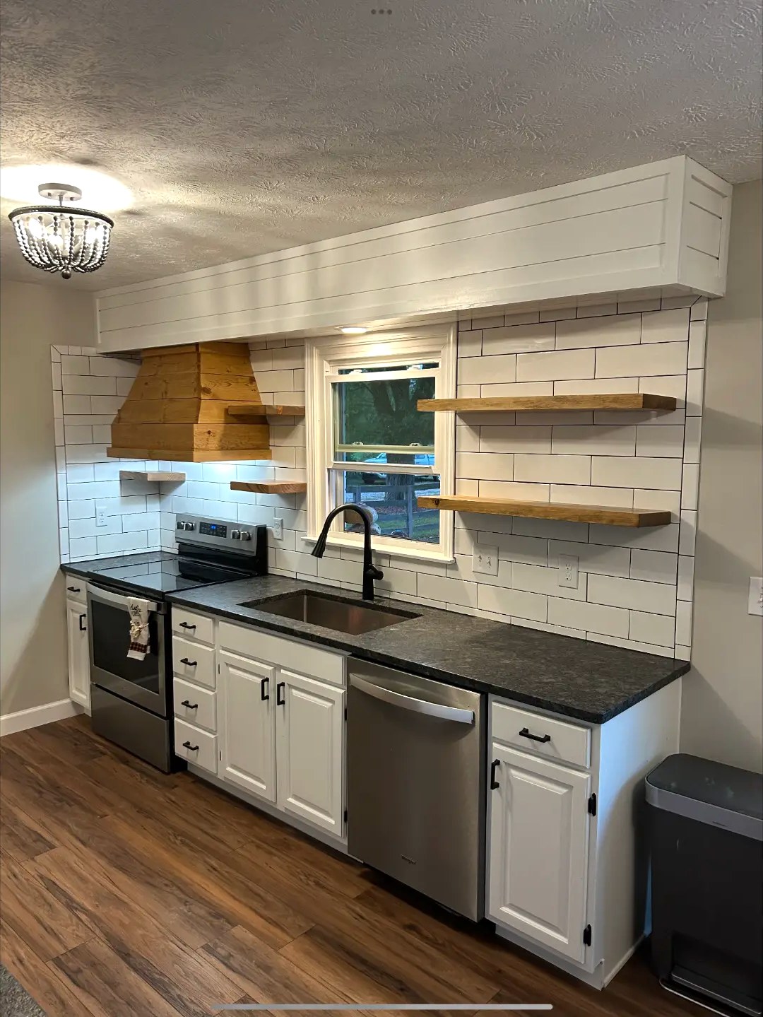 Subway Tile Kitchen with Wood Range Hood